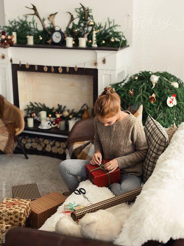 View _Woman Wrapping Gifts_ by Stocksy Contributor _Milles Studio_